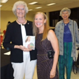 Nancy Addison speaker at Presbyterian Hospital's Cancer Support Community. Nancy Addison and a lady w_Nancy's book