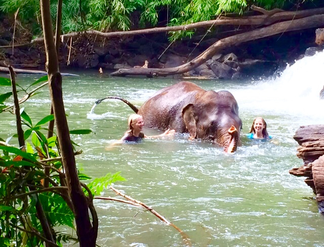 Nancy Addison in water w elephant and daughter amanda in cambodia FullSizeRender(10) copy